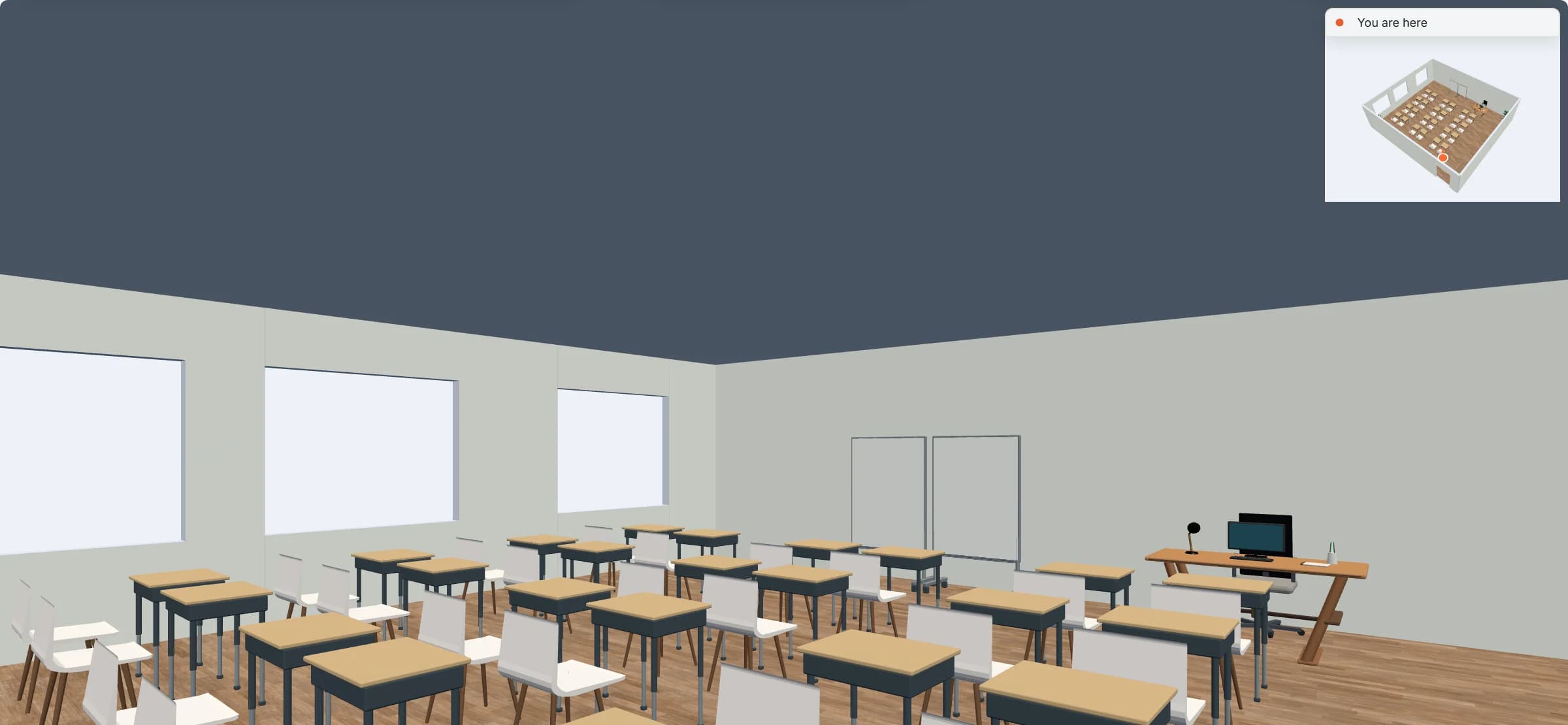 Walkthrough at eye height from the door at the back of the classroom: rows of pupil desks and chairs leading to the two teaching boards, windows on the left, and a small overview map of the room