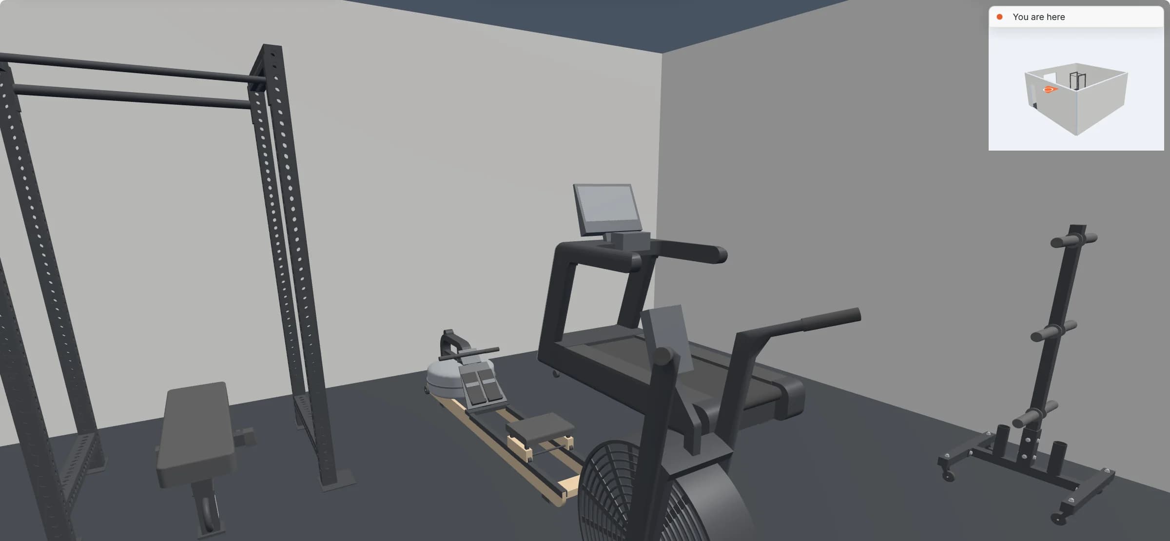 Walkthrough at eye height in the garage gym: the power rack with its flat bench on the left, the rower, the treadmill and the air bike ahead, the plate tree on the right, and a small overview map of the room